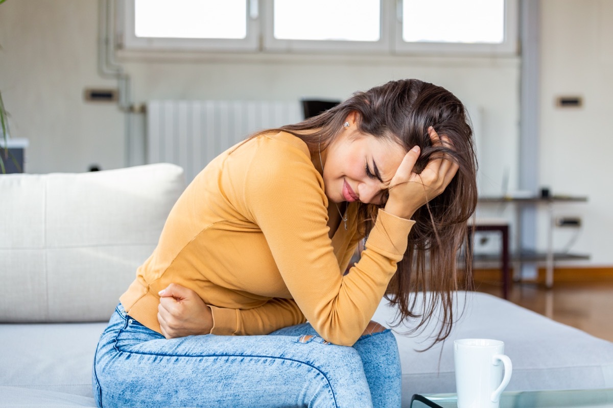 young woman with stomach pain