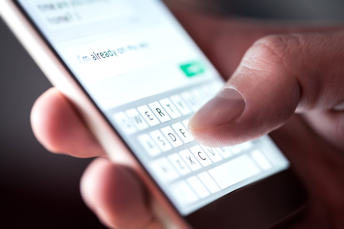 close-up of a man sending a sexy text message