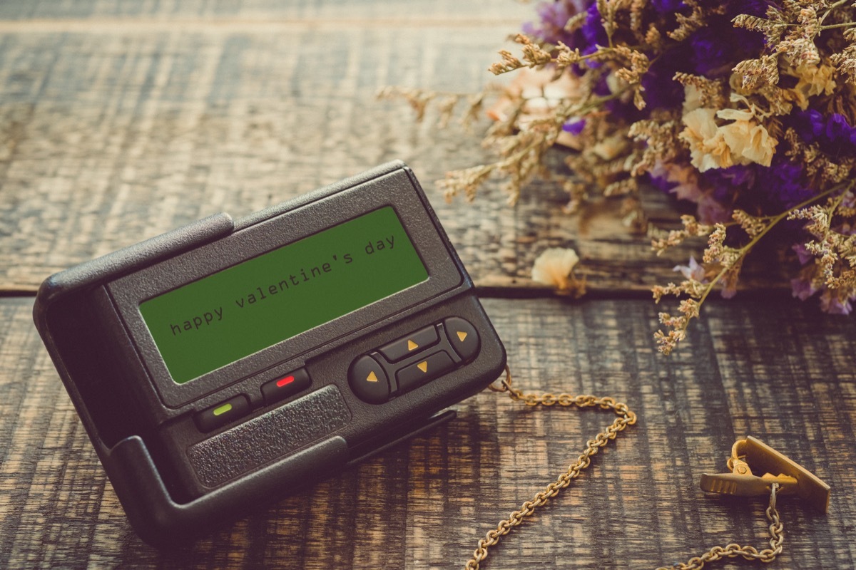 pager on a wooden table reading happy valentine's day