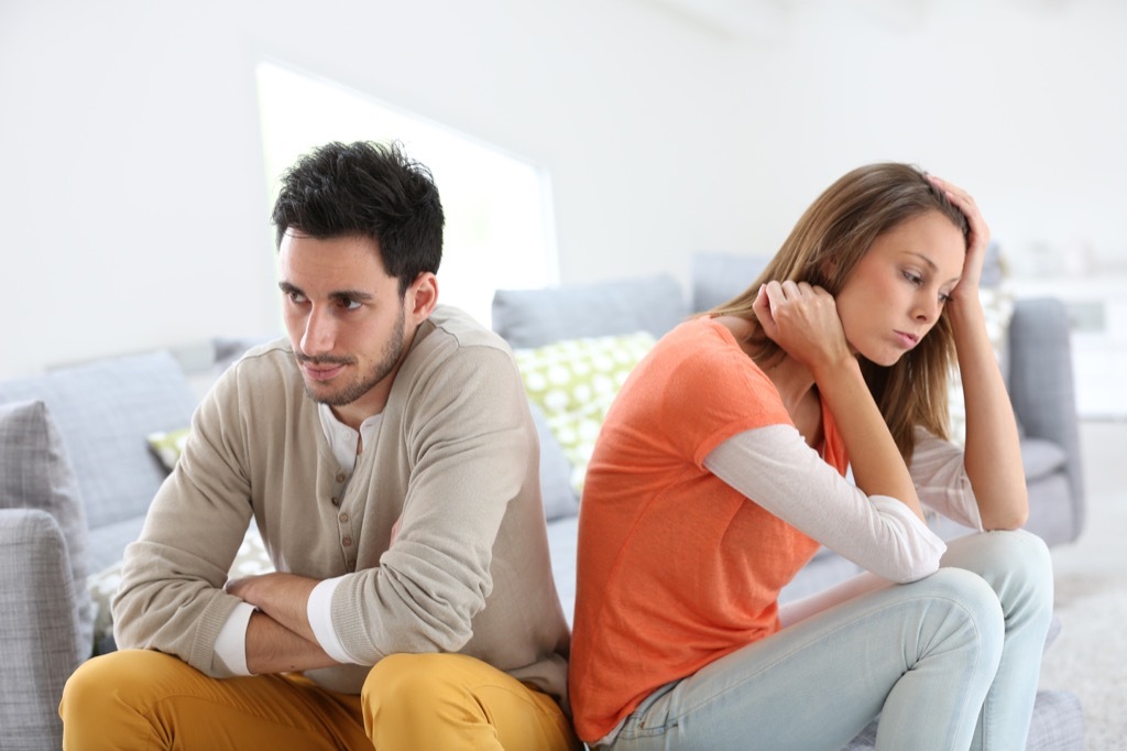 Couple arguing on the couch