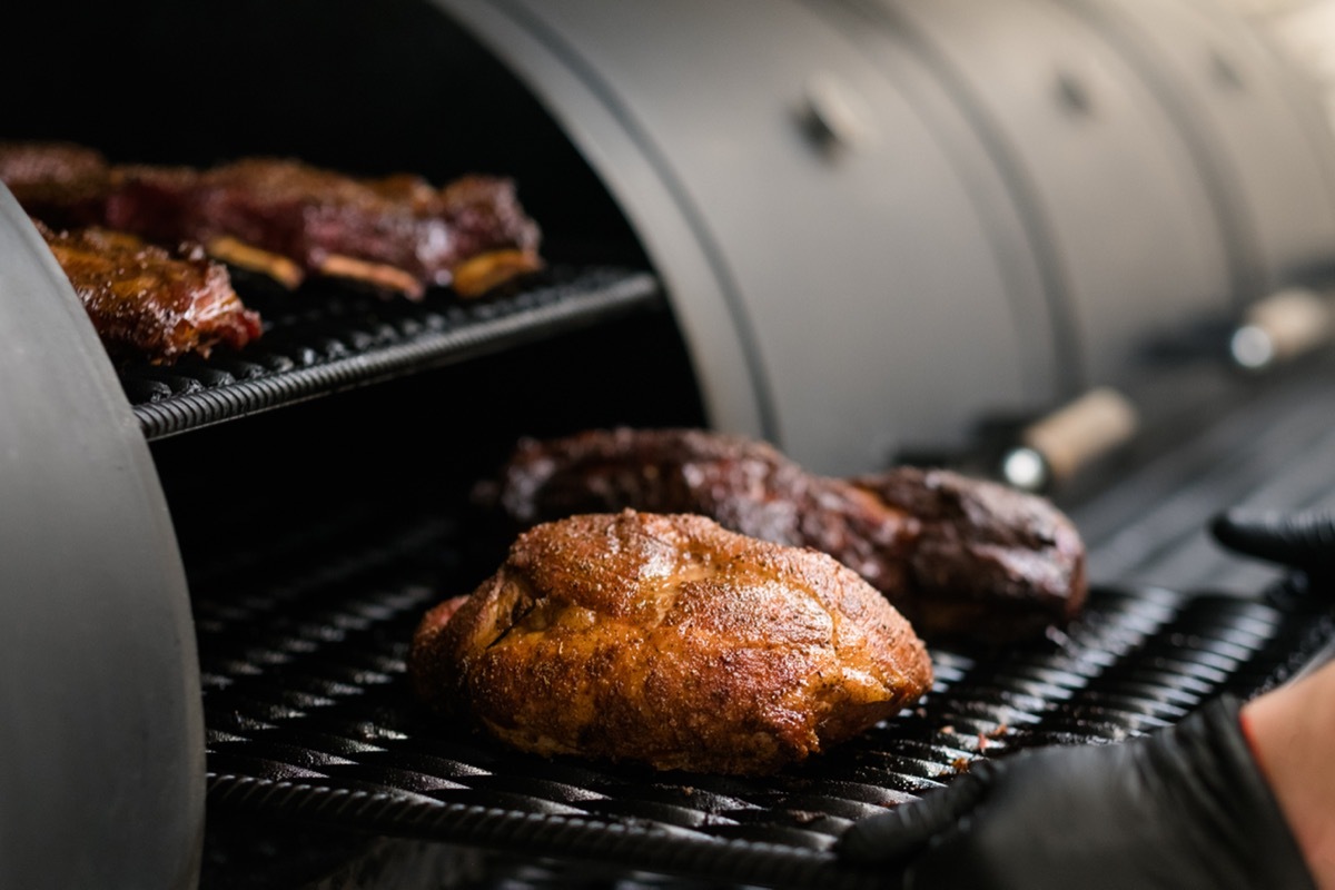 Meat Coming Out of a Smoker