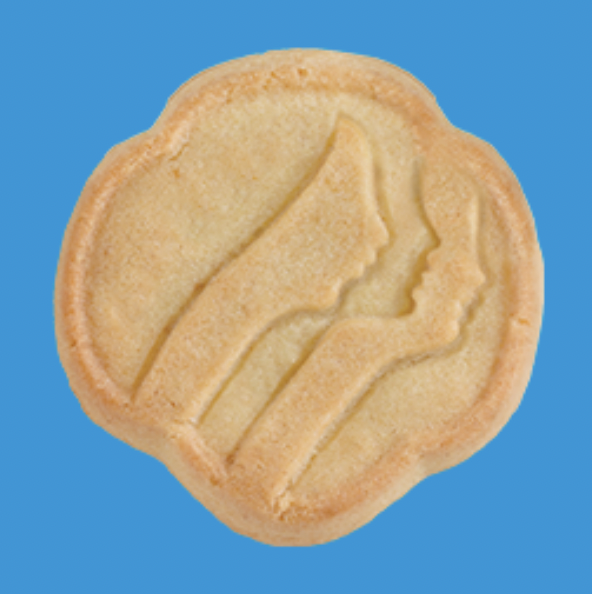 A Girl Scout Trefoil Cookie against a blue background