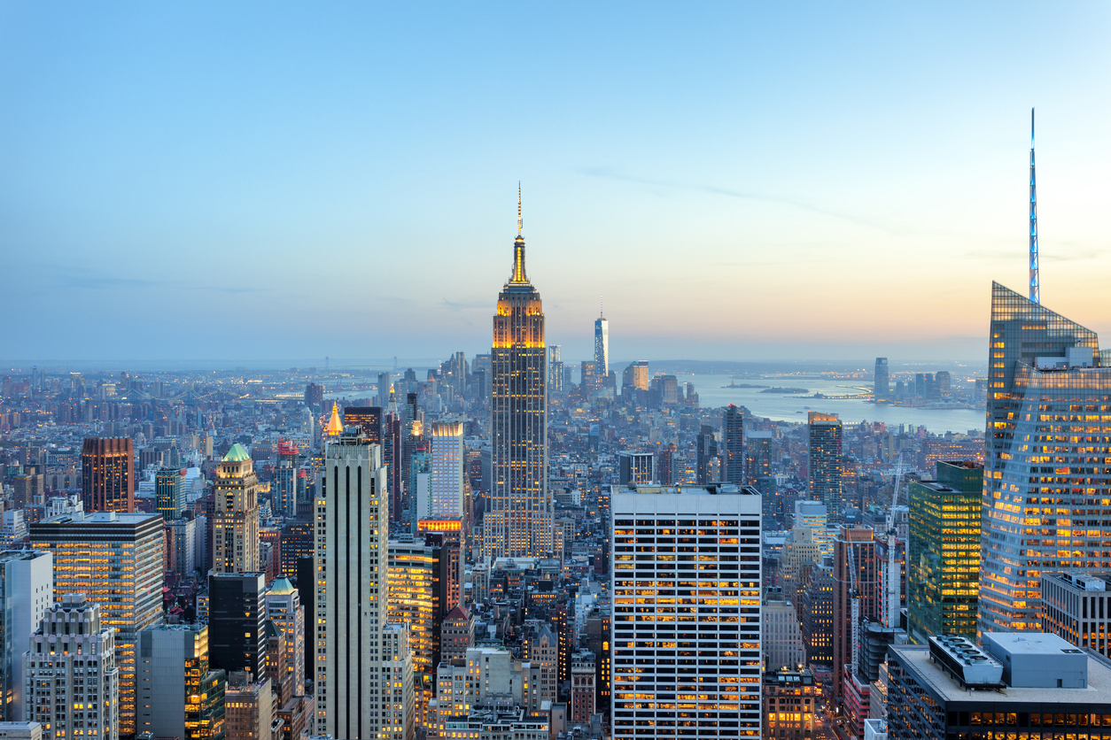 illuminated skyscrapers in Manhattan at evening with Empire State Building and Freedom Tower - the new World Trade Center, New York City