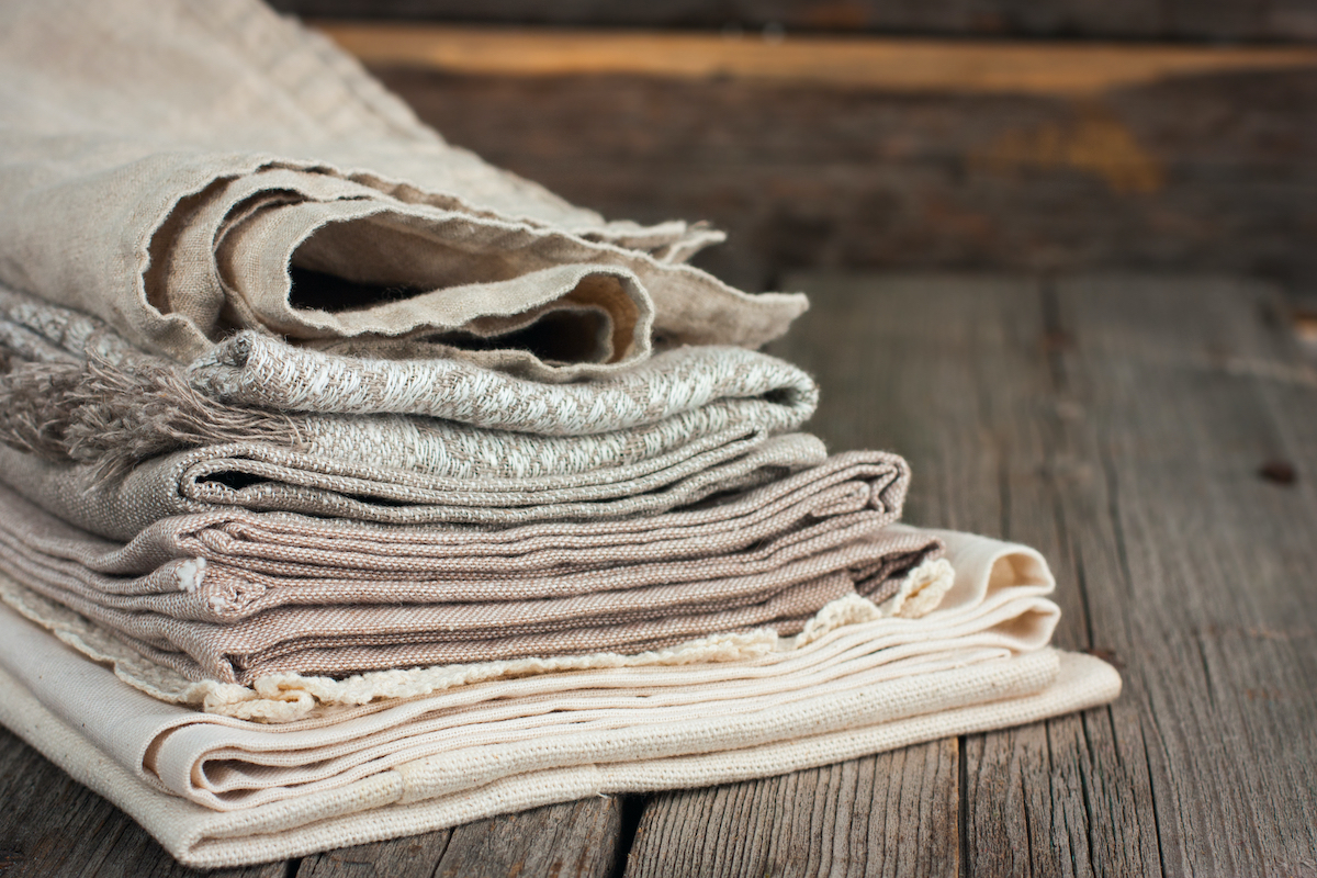 pile of linen material on wood boards