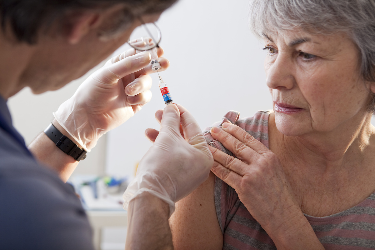 Older woman getting vaccinated