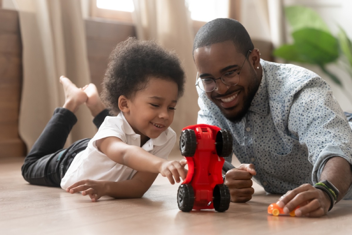 man and young boy playing with car on the floor, things grandparents should never do