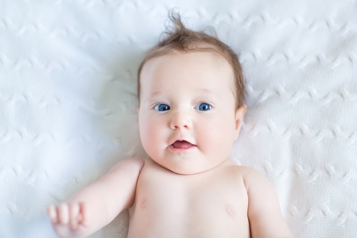 white baby on white bedding