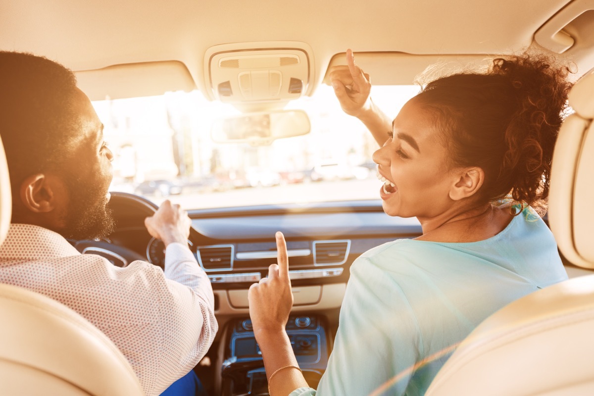 people singing in a car