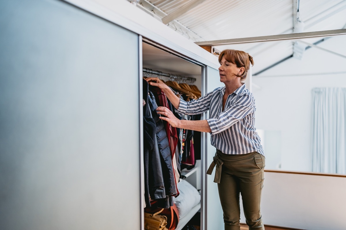 older woman getting dressed