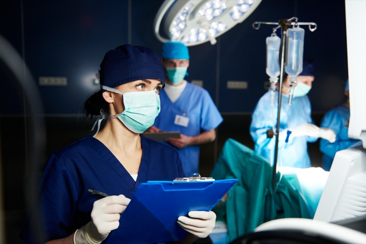 Nurse in hospital examining all the parameters