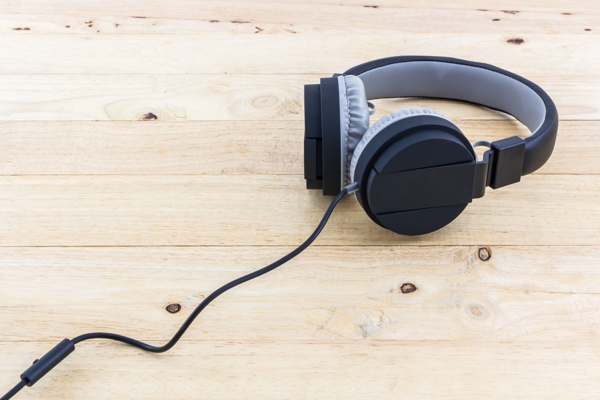 black headphones on wooden table