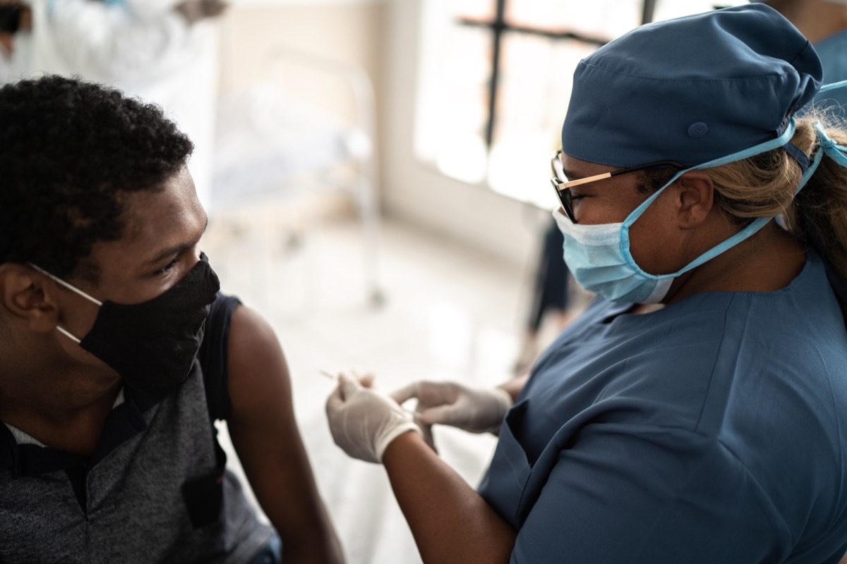 Teenager boy being vaccinated