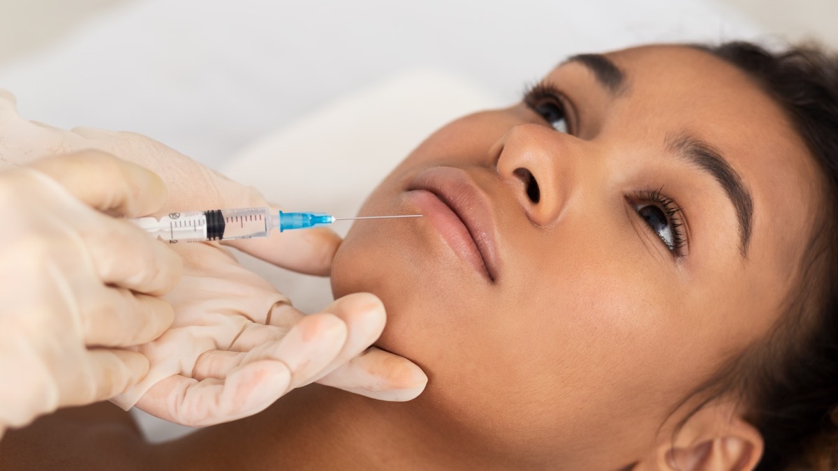 Woman getting lip injections