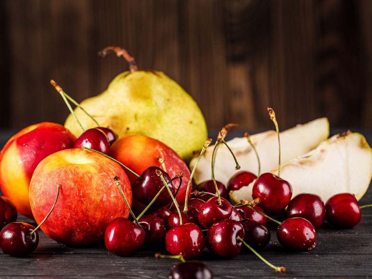 fruit basket with apples, pears, cherries