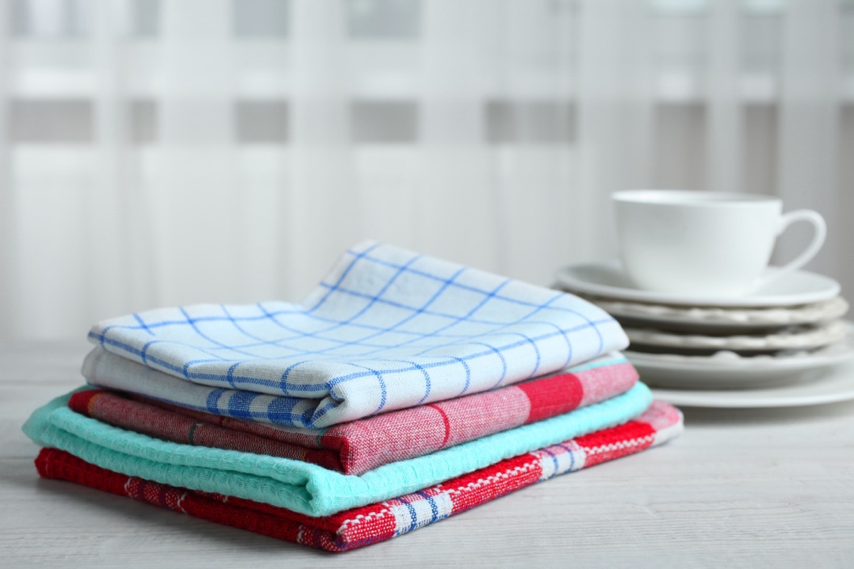 Kitchen towels and dishes on a wooden table