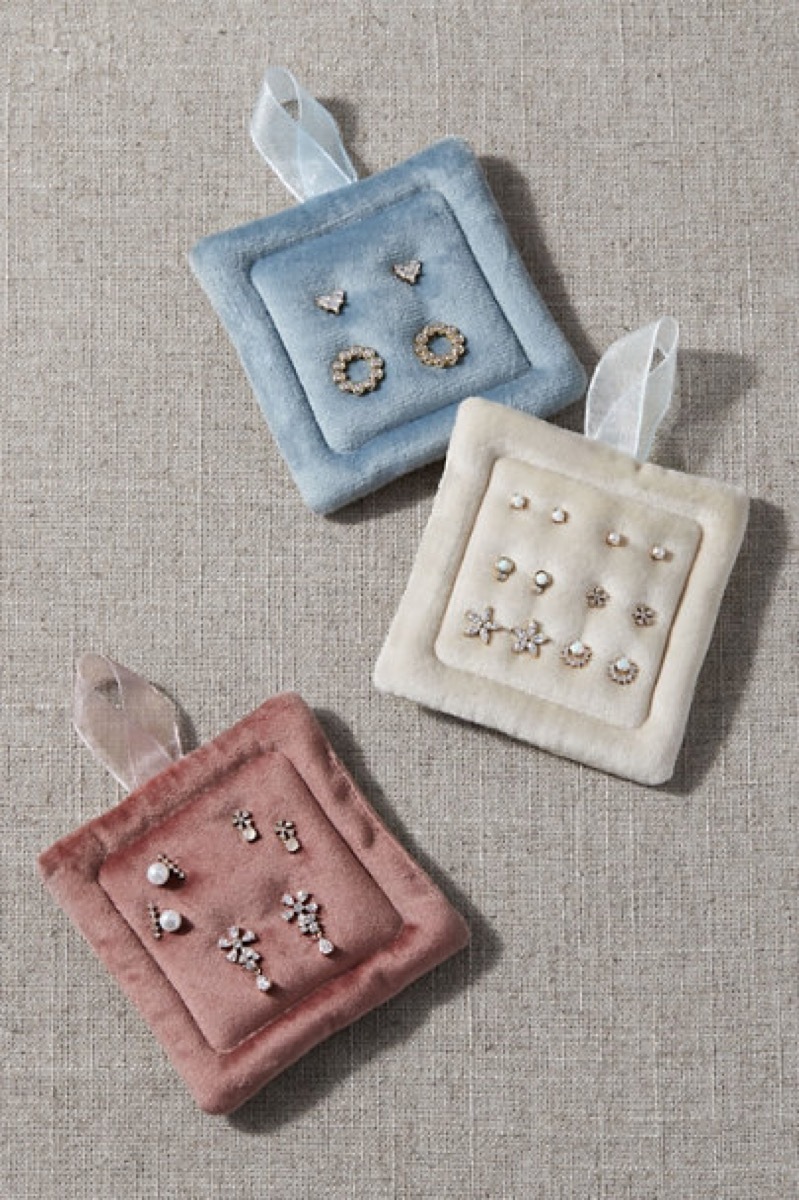 Earring sets on three velvet earring holders