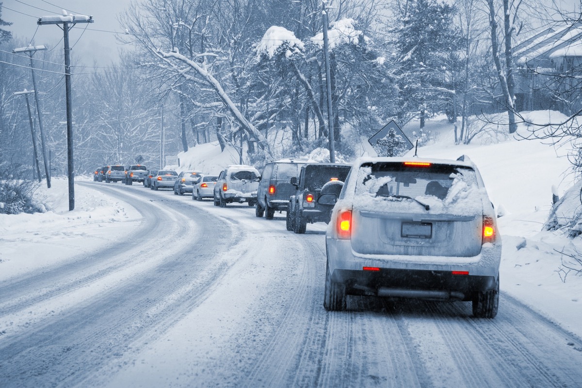 Line of Cars Driving in Snow