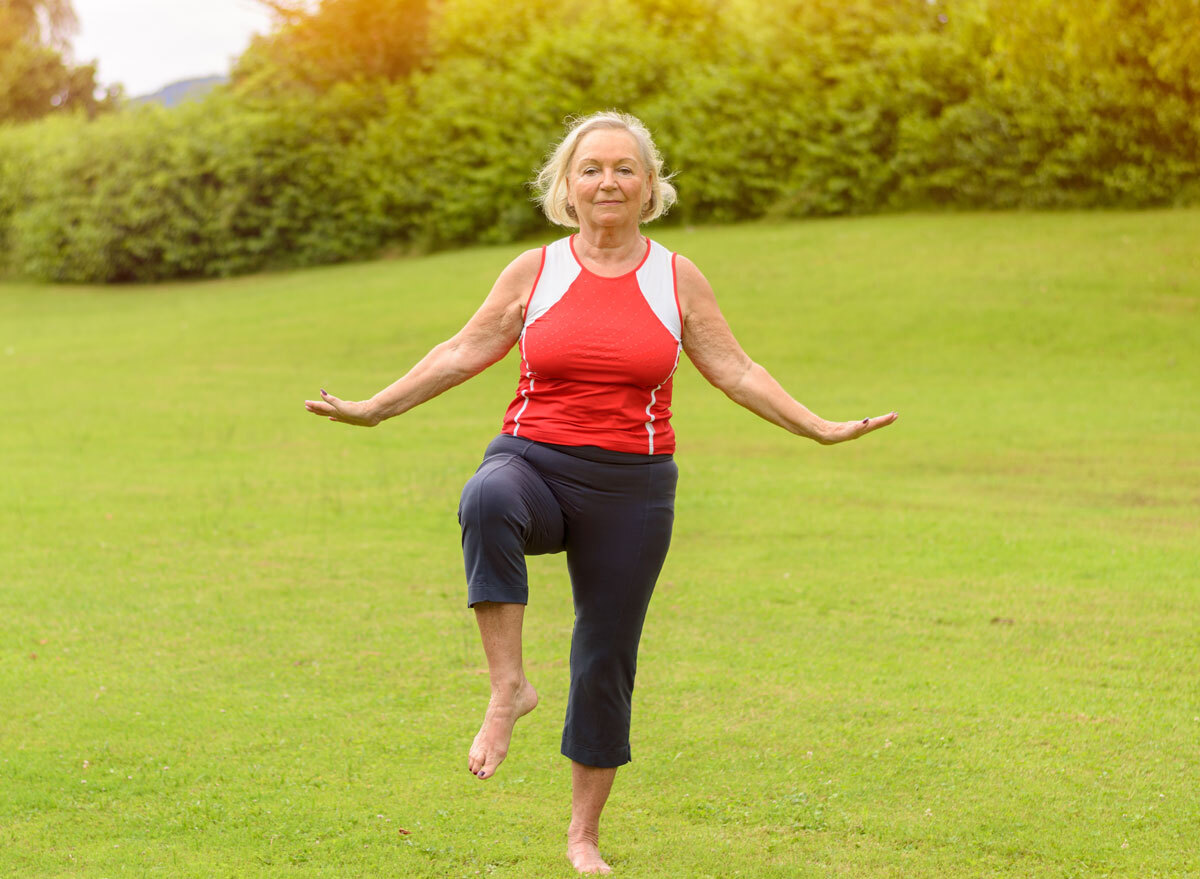 Woman balancing on one leg