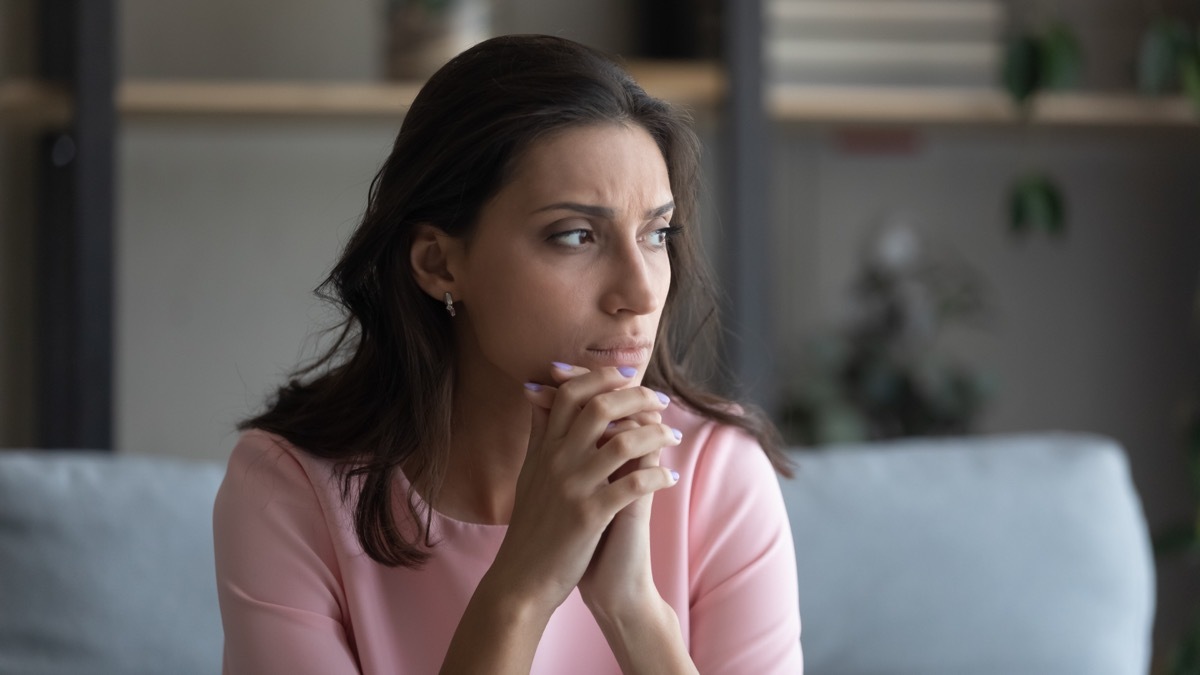 insecure woman looking out window