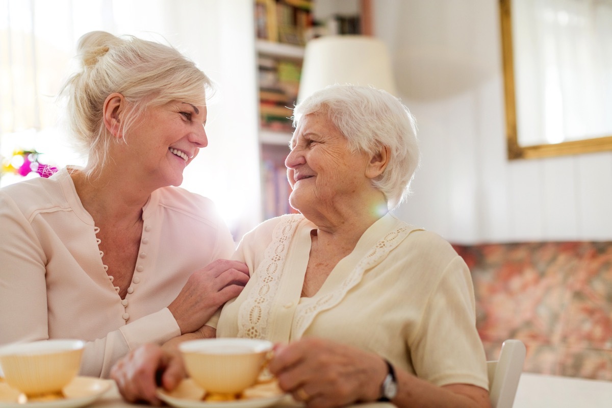 senior woman smiling at daughter