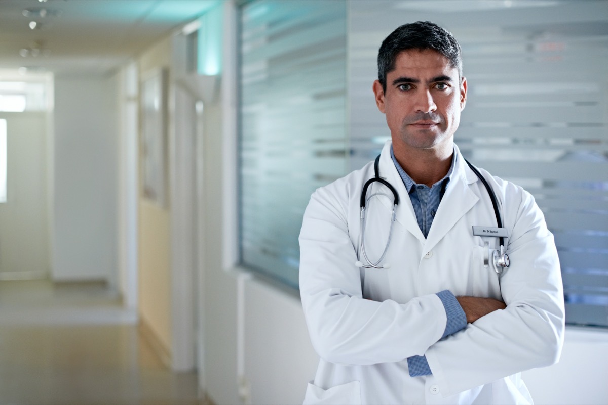 Doctor standing in a hospital corridor.