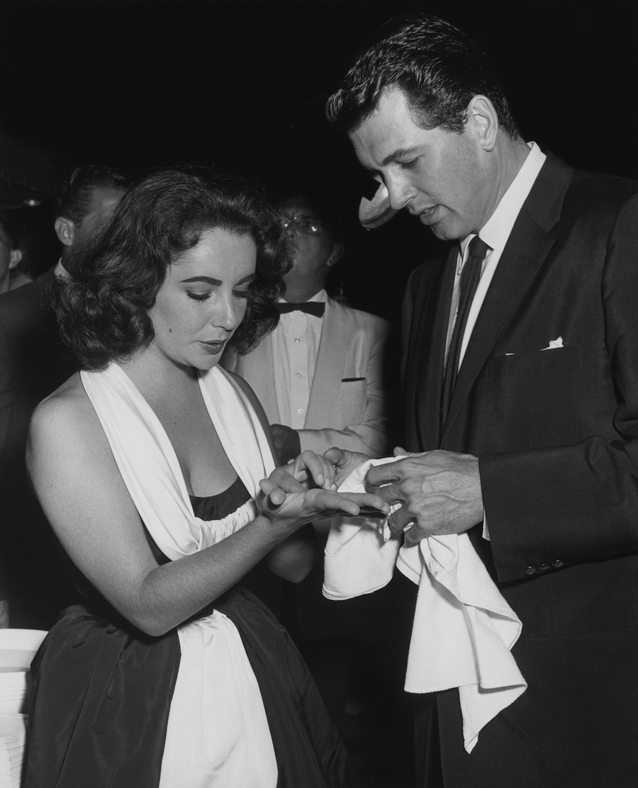 Elizabeth Taylor and Rock Hudson at a handprint and footprint ceremony at Grauman's Chinese Theatre in 1956