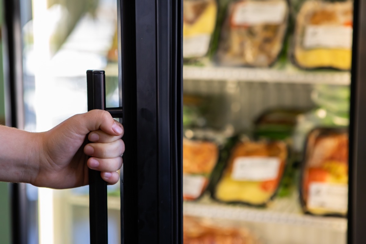 opening freezer door at store