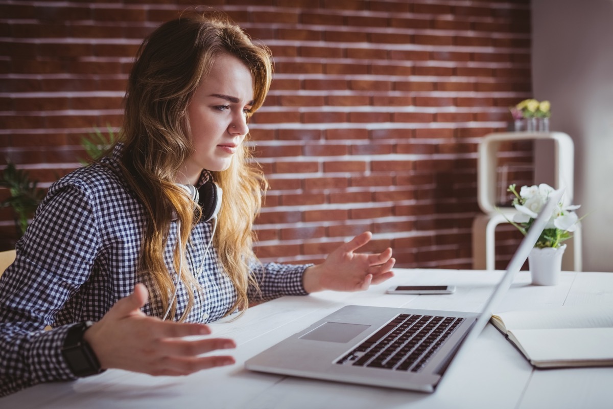 woman confused looking at computer