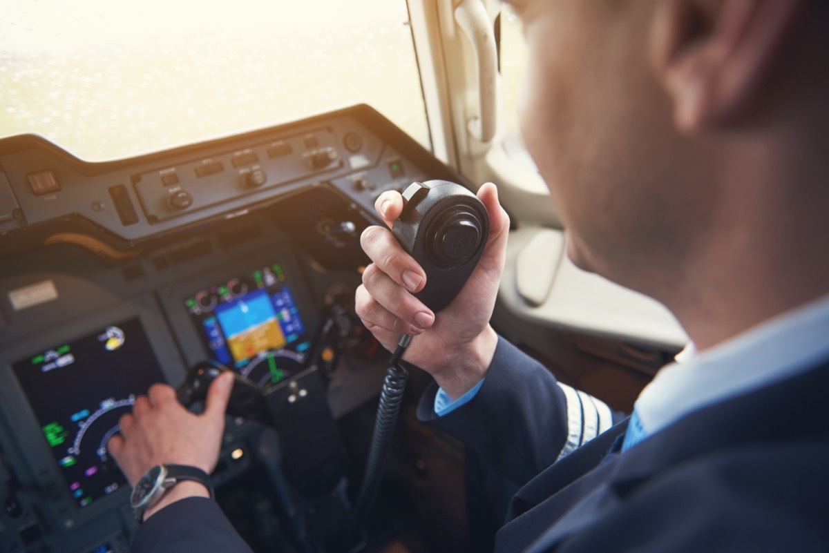 pilot talking on his radio