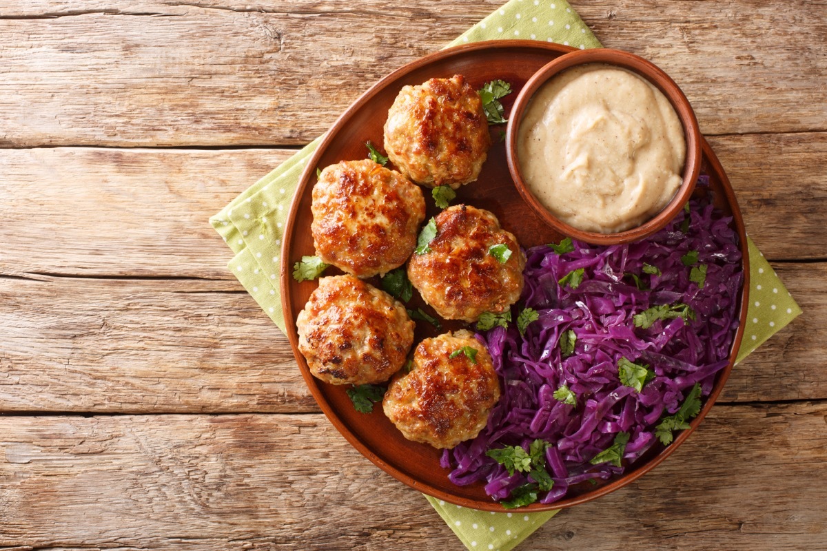 meatballs, purple cabbage, and sauce on plate