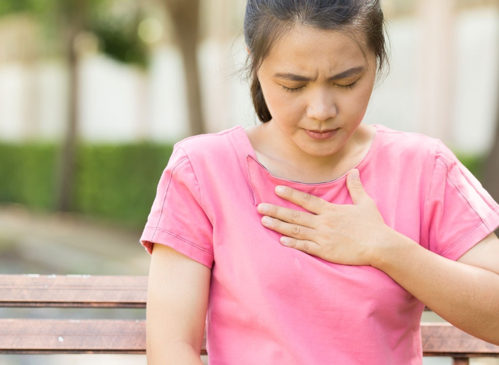 Woman clutching heart