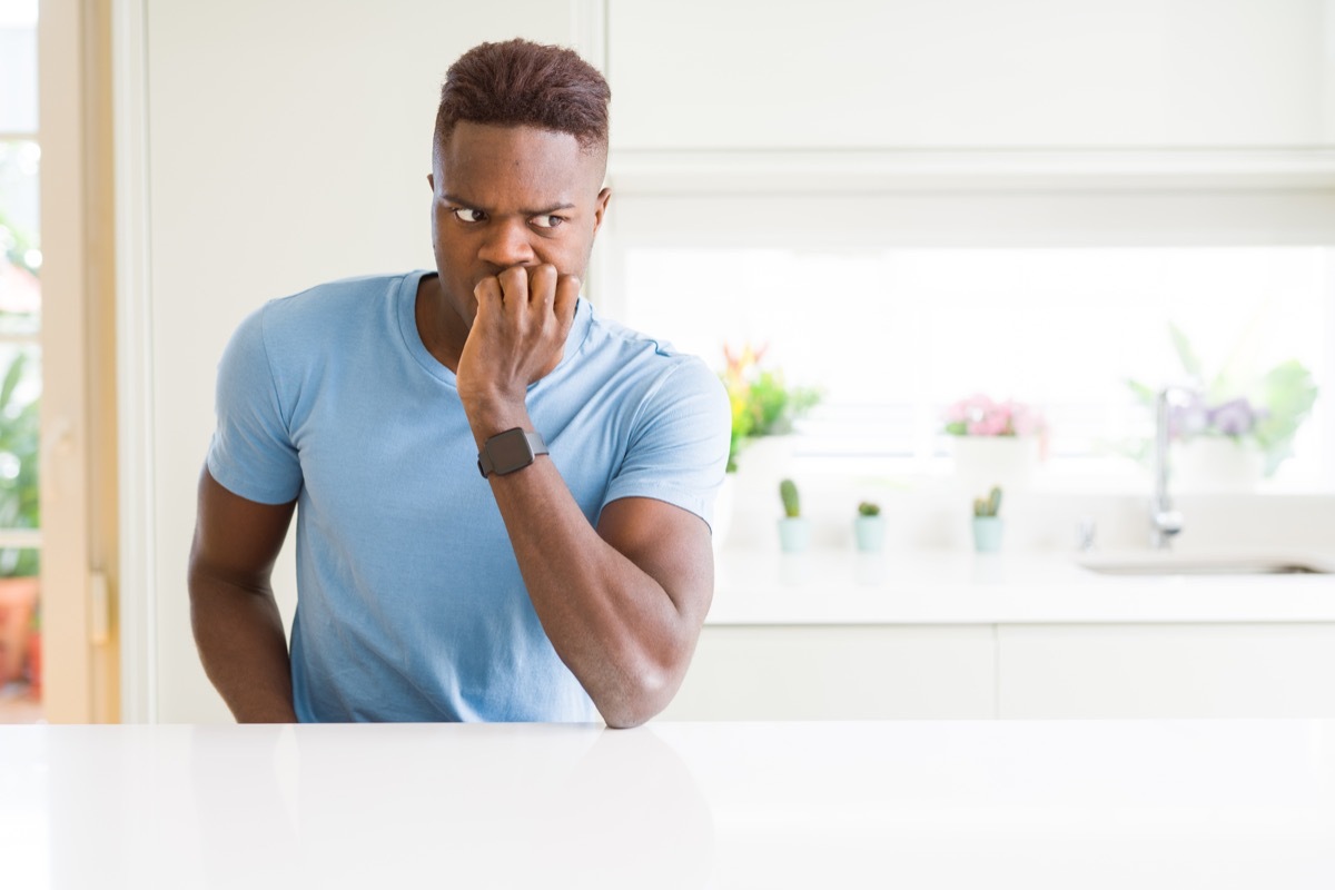 man biting his nails