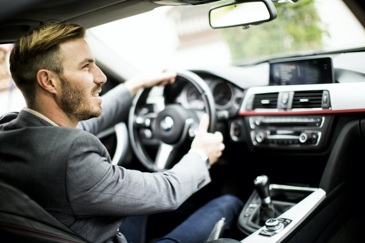 man driving in the modern car.