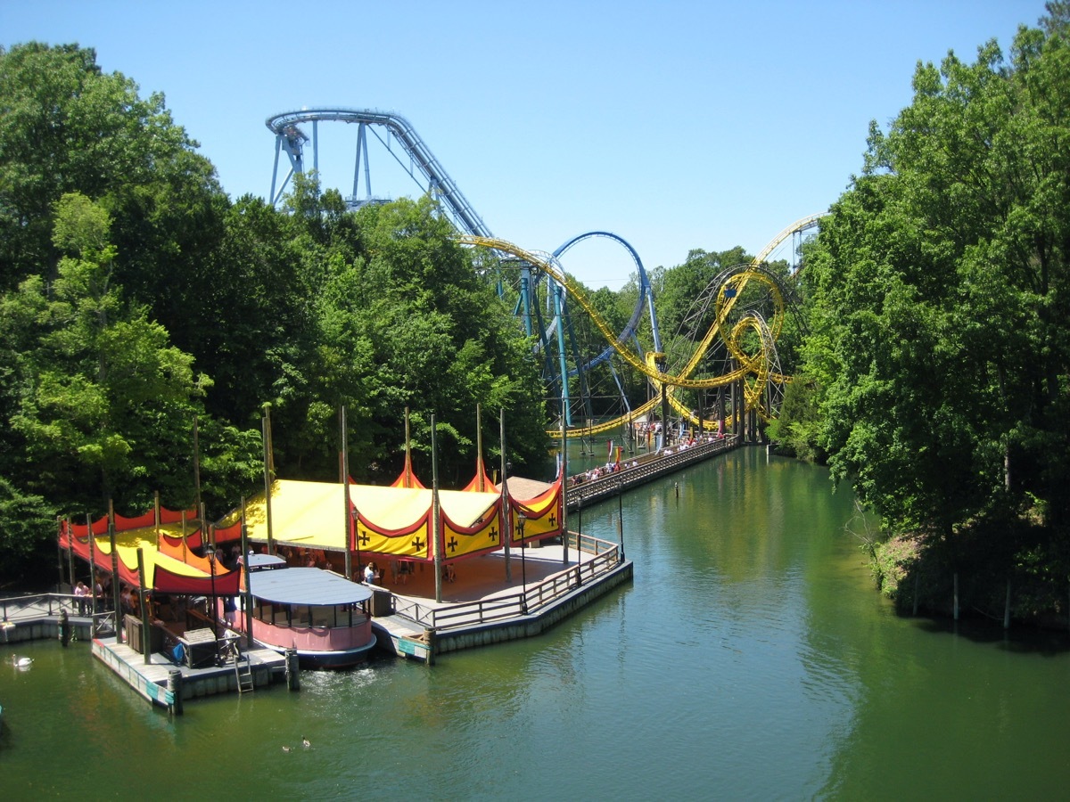 Roller Coaster and river boat ride at Busch Gardens in Williamsburg, Virginia on a sunny day.