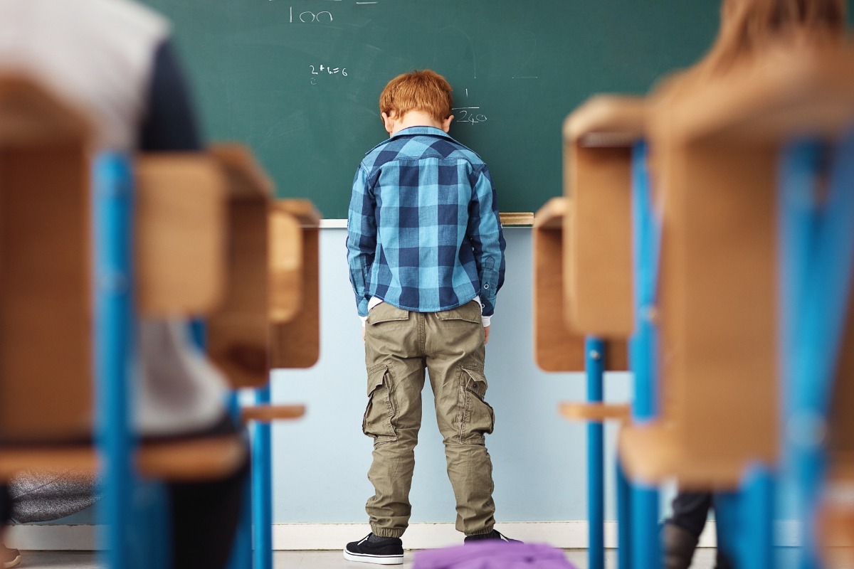 young boy hanging out in school