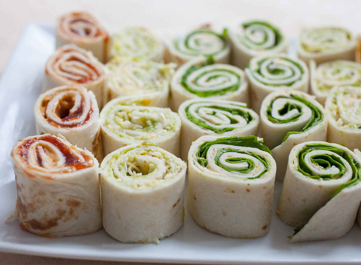 three types of pinwheel roll ups on serving platter