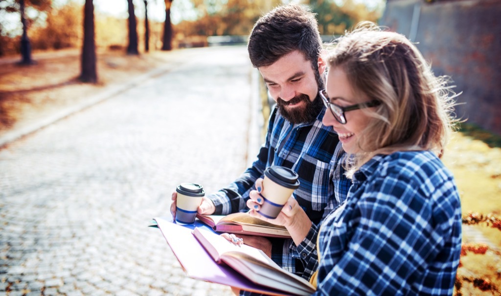 Couple Reading Poems on Road