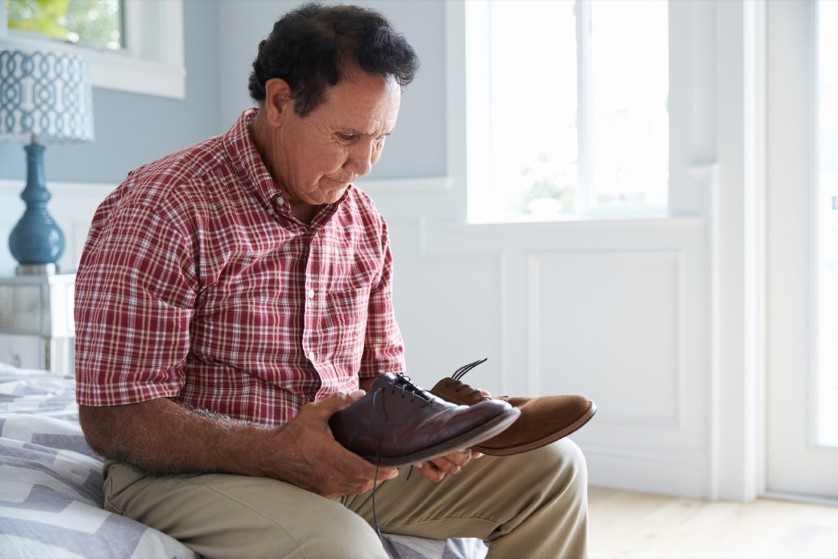 Man Suffering With Dementia Trying To Dress