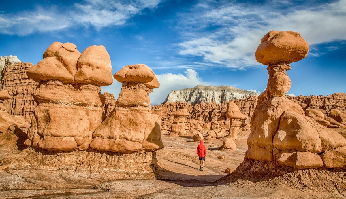 man walks in goblin valley state park