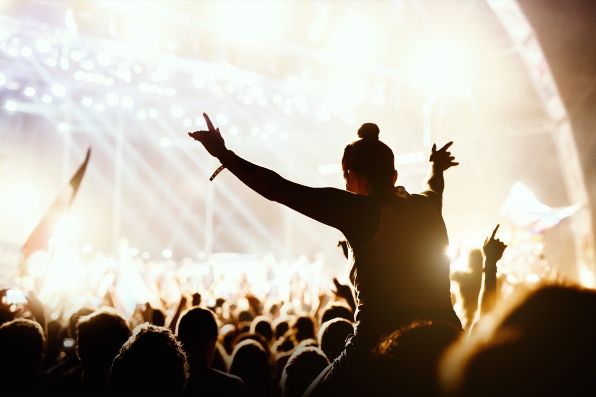 Girl enjoying the outdoor music festival concert. -