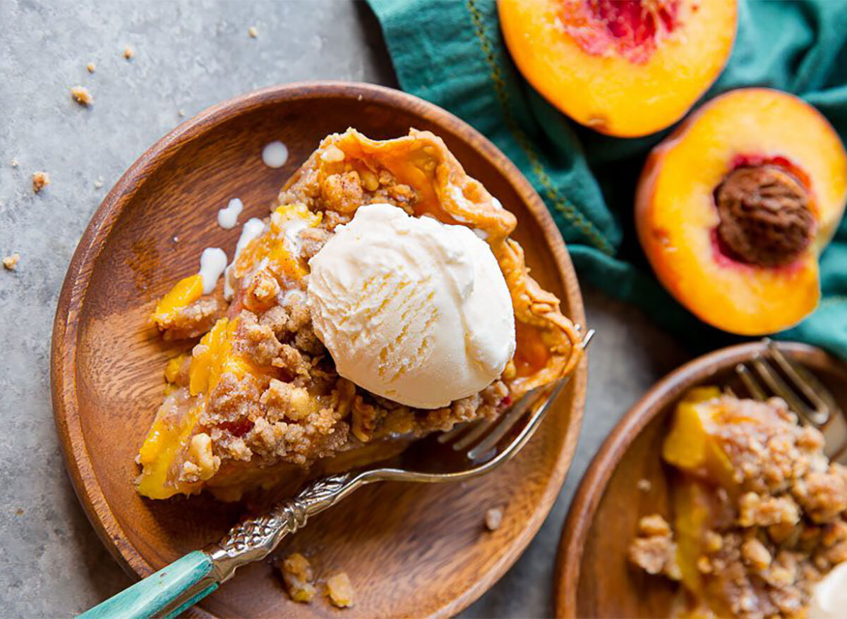 peach crumble pie slice with ice cream