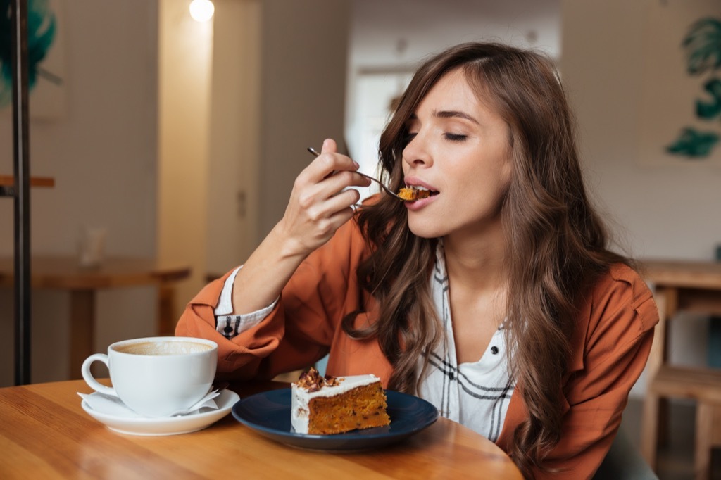 woman eating cake unhealthy