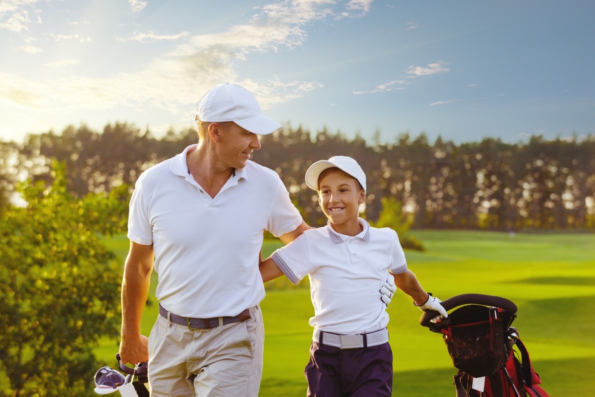 Father and son golfing together