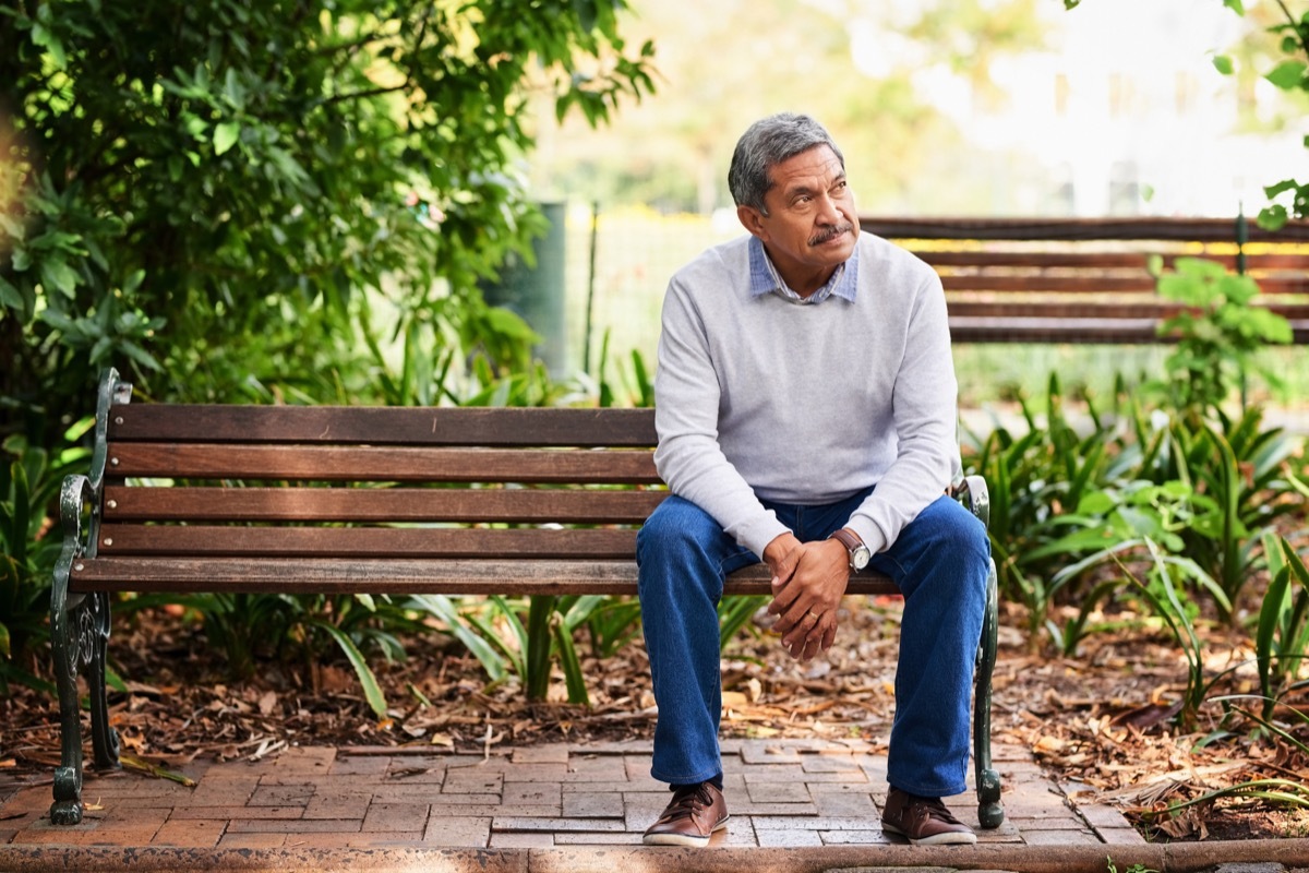 Shot of a mature man looking thoughtful and sad outdoors