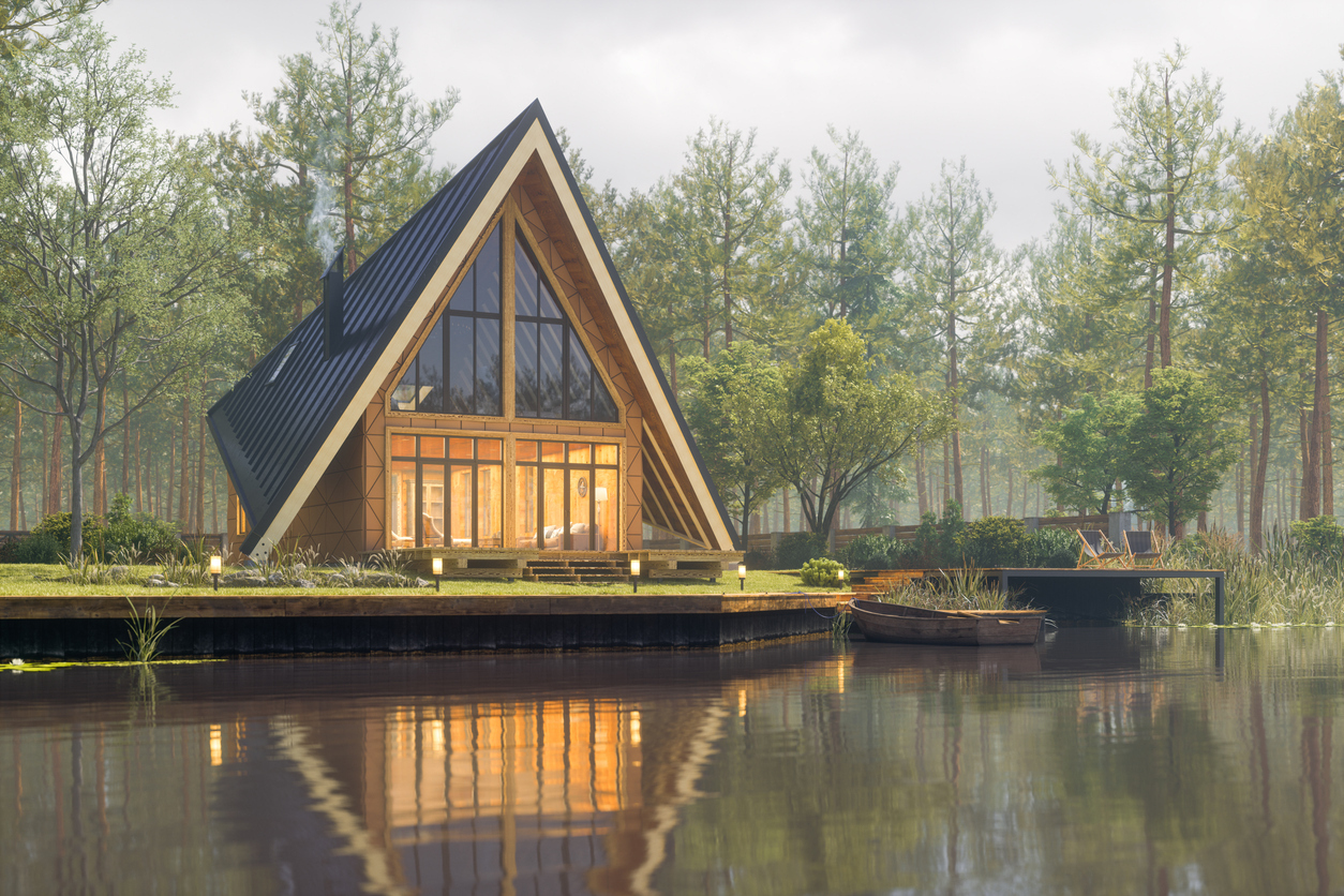 Triangular modern lake house made of natural wood