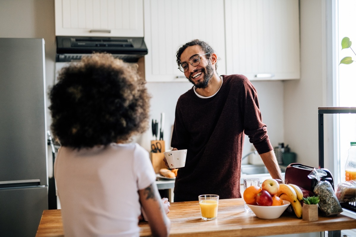 couple in kitchen preparing food