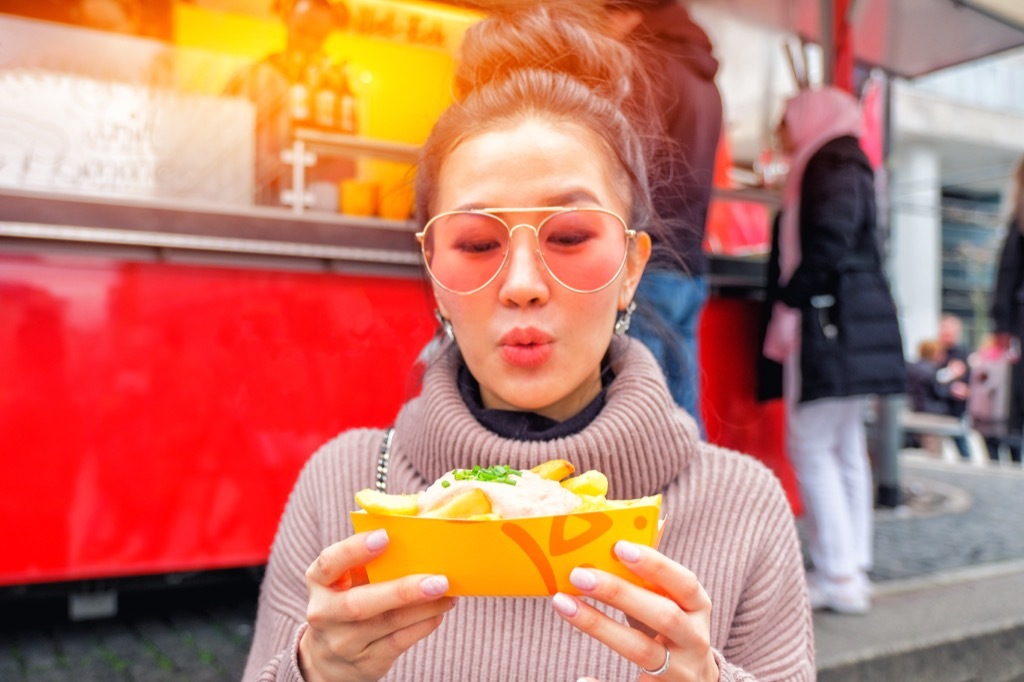 woman eating french fries