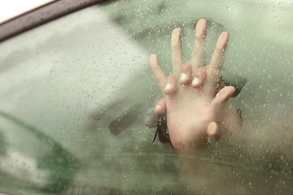 Couple having sex in a car. Meant to symbolize an affair.