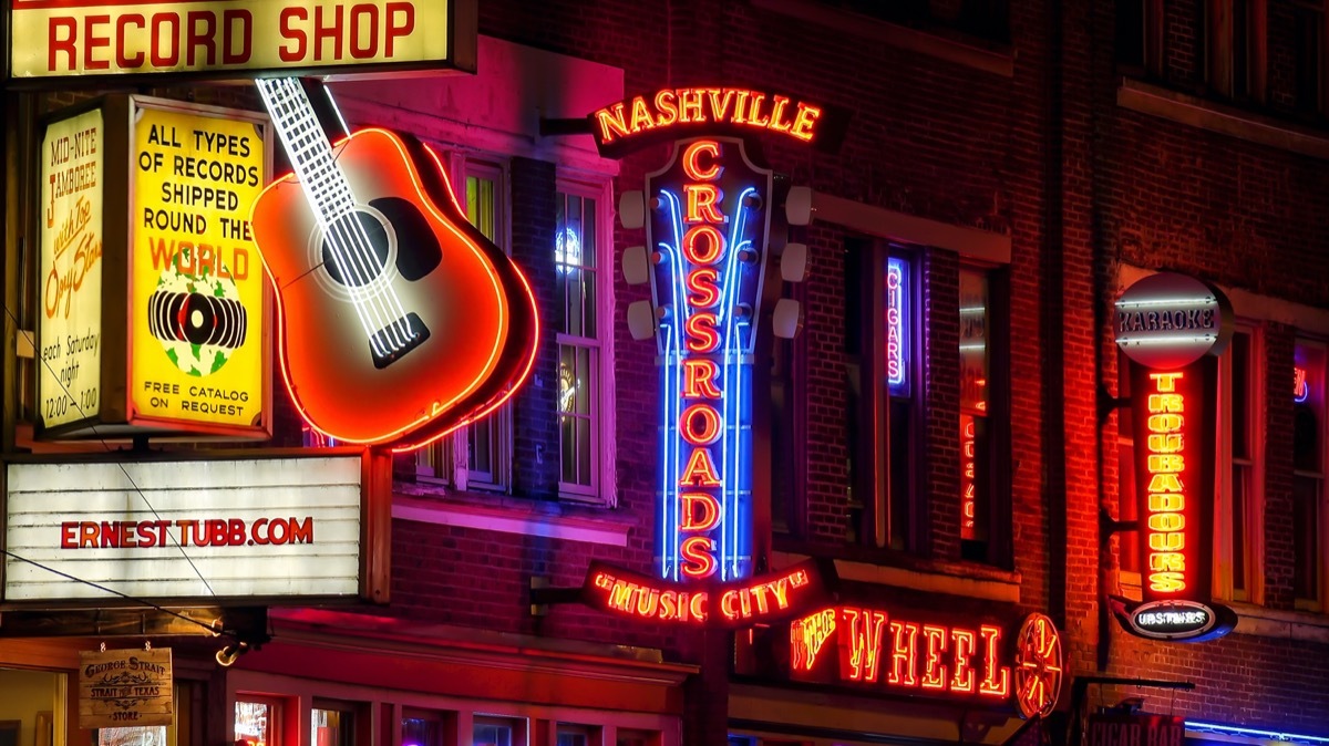 Neon signs at night along Broadway Street in Nashville, Tennessee