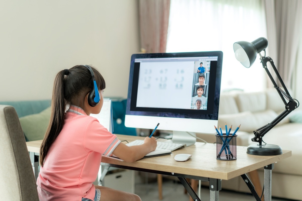 Young girl distance learning with computer